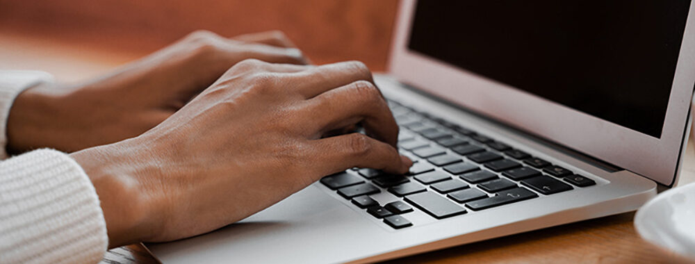 black-woman-hands-typing